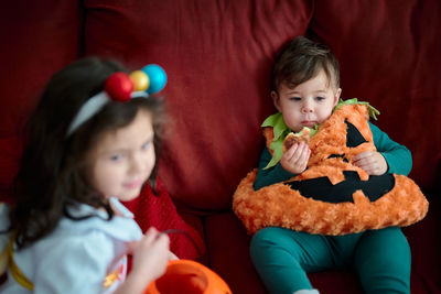 Brother and sister in their halloween costumes