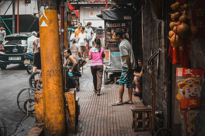 People standing on street in city