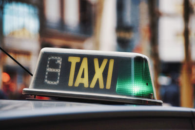 Close-up of information sign on taxi