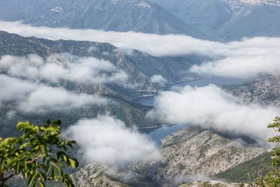 High angle view of fog over mountains