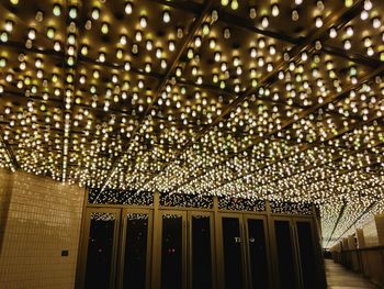 Low angle view of illuminated ceiling