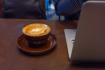 High angle view of coffee cup on table