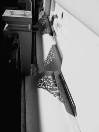 Low section of woman sitting on table