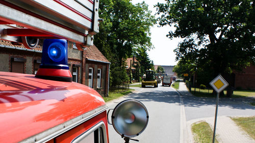 Car on road along buildings