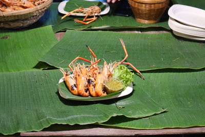 Close-up of leaves in container on table