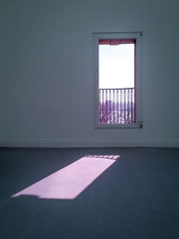 Sunlight streaming into empty room