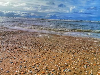 Scenic view of beach against sky