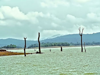 Scenic view of sea against cloudy sky