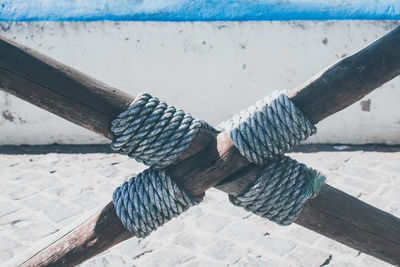 High angle view of rope tied on pier