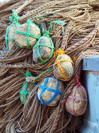 Pile of stones tied on ropes in boat