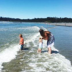 Family wading in sea