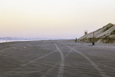 Scenic view of beach against clear sky