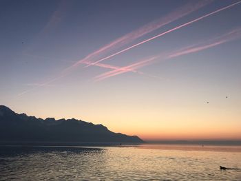 Scenic view of sea against sky at sunset