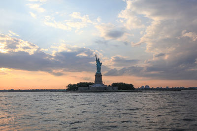 View of statue of liberty against sunset
