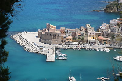 High angle view of city by sea