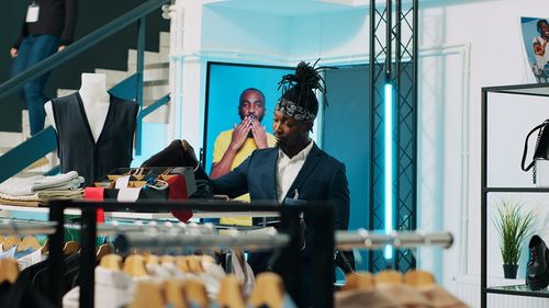 Side view of woman standing in store