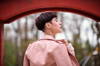 Rear view of teenage girl looking away