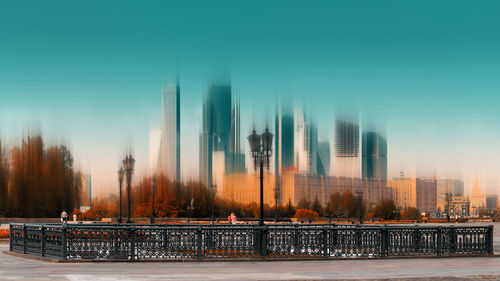 Panoramic shot of cityscape against clear sky during winter