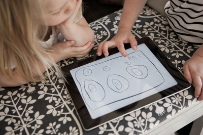 Children using digital tablet