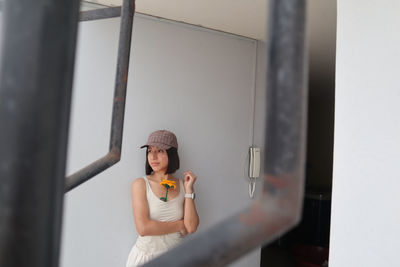 Portrait of young woman working at home