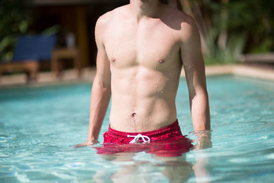 Man standing in swimming pool