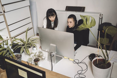 Businesswomen working on computer at place of work