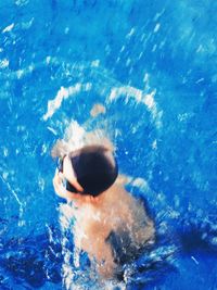 High angle view of man swimming in pool