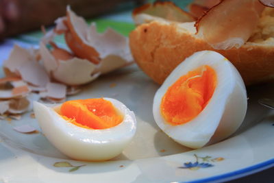 Close-up of boiled egg in plate