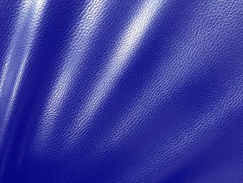 Full frame shot of blue leather sofa