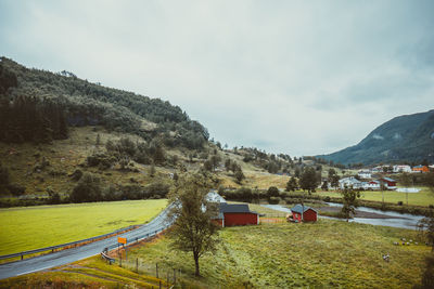 Scenic view of landscape and mountains against sky