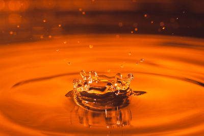 Close-up of drop splashing in water