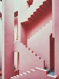 Row of spiral staircase in building