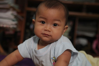 Portrait of cute baby boy at home