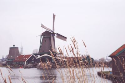 Traditional windmill against sky