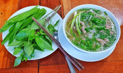 High angle view of leaves in bowl on table