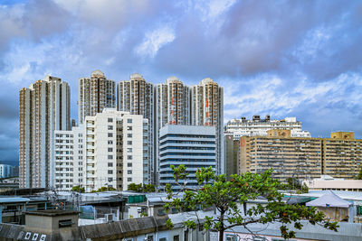 Buildings in city against sky