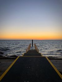 Scenic view of sea against clear sky during sunset