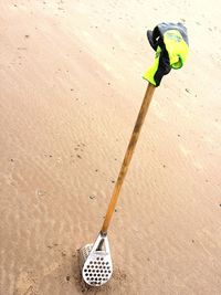 High angle view of person holding umbrella on sand