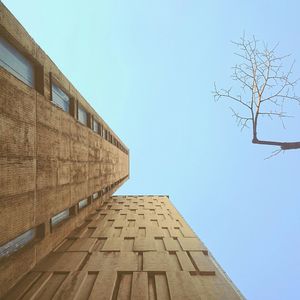 Low angle view of building against clear blue sky