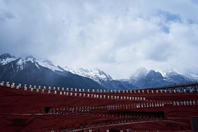Scenic view of snow covered mountains against sky