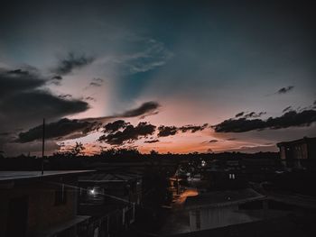 Scenic view of town against sky during sunset