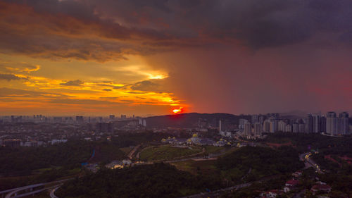 High angle view of townscape against sky during sunset