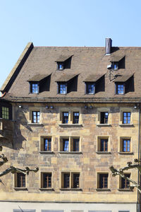 Low angle view of residential building against clear sky