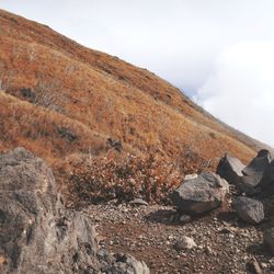 Rock formations on landscape against sky