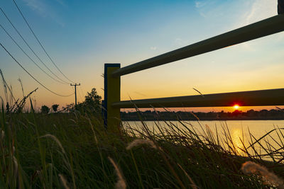 Scenic view of field against sky during sunset