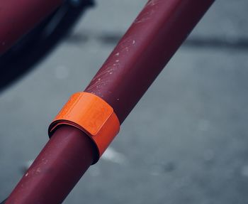 Close-up of water drops on metal railing