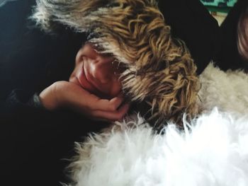 Close-up portrait of man with dog relaxing at home