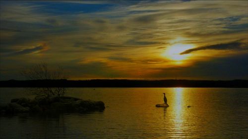 Scenic view of lake at sunset