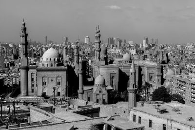 Panoramic view of buildings in city against sky