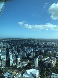 High angle view of buildings in city against sky